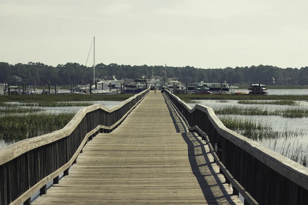 Long wooden walkway extending over Lowcountry water in Bluffton, South Carolina
