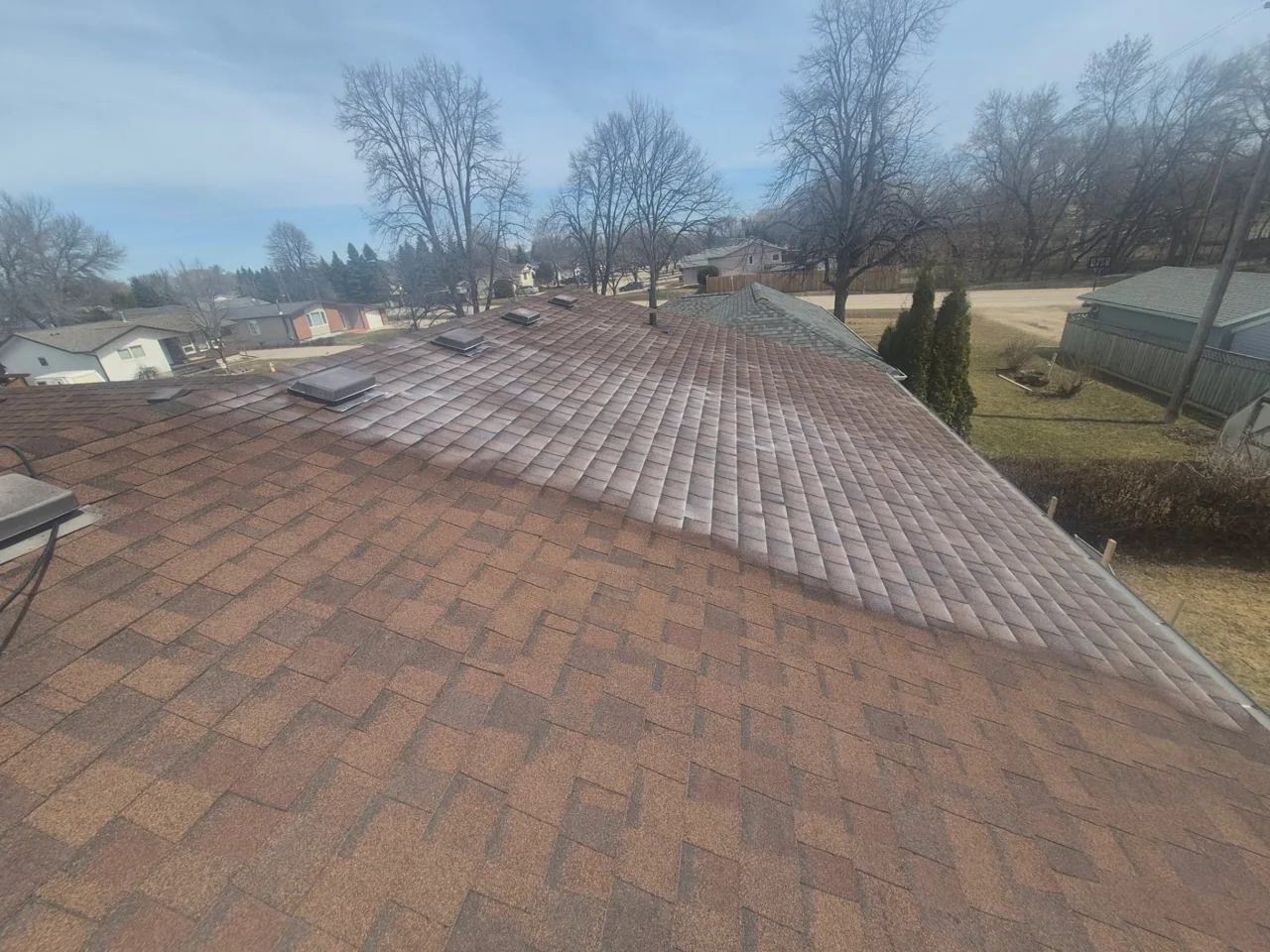 Roof Doctors of Georgia performing professional roof rejuvenation on an asphalt shingle roof in Savannah, GA.